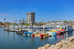 Guests can enjoy stunning views of the marina from the adjacent hotel.