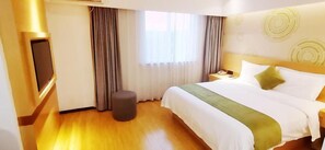 A hotel room with a bed, a bedside table, a television, and a window with curtains. - Greentree Inn Yangzhou Jiangdu Xiaoji Town South Zhongxing Road Express Hotel (Yangzhou)