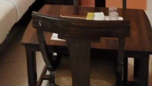 A small room with a bed, a wooden table, and a chair. - Tiger Tales Resort (Palia Kalan)