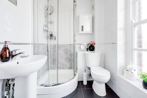 Shower, hair dryer, towels, soap