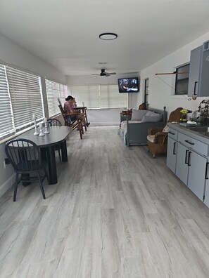 Enjoy a comfortable stay in this stylish room with a dining area, sofa, and TV.