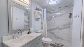 Combined shower/tub, hair dryer, towels, soap
