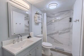 Combined shower/tub, hair dryer, towels, soap