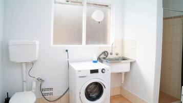 Shower, towels, soap, toilet paper