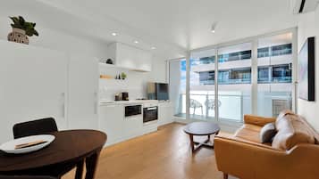 Apartment, 1 Bedroom | Living area | 32-inch flat-screen TV with digital channels