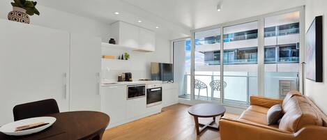 Apartment, 1 Bedroom | Living area | 32-inch flat-screen TV with digital channels