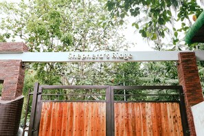 A wooden gate with a sign reading "Shepherd's Ridge" above it.