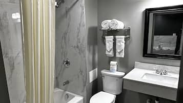 Combined shower/bathtub, towels, soap, shampoo