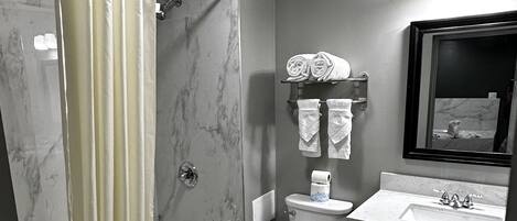 Combined shower/tub, towels, soap, shampoo