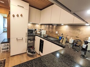Fridge, oven, cookware/dishes/utensils, dining tables