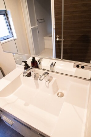 Hair dryer, towels, soap, shampoo
