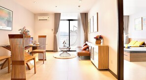 Deluxe Apartment, Balcony | Living area | 45-inch flat-screen TV with cable channels, pay movies