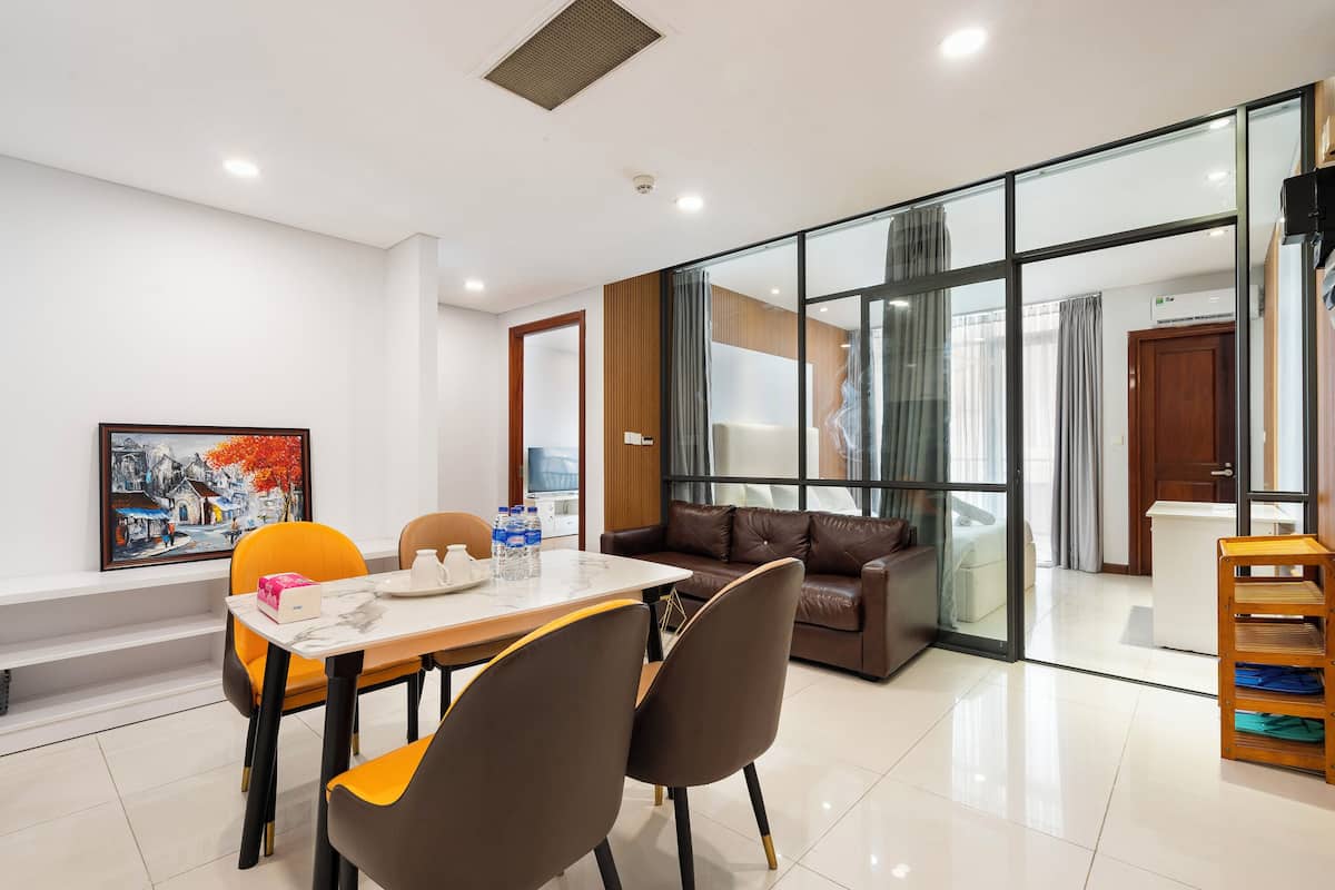 Deluxe Apartment, 3 Bedrooms, City View | Living area | 32-inch Smart TV with cable channels, offices