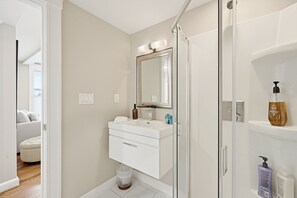 Shower, hair dryer, towels, shampoo