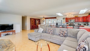 A spacious living room with a sectional sofa, a glass coffee table, and a flat-screen TV. - Scenic Home w/ Sauna - 7 Mi to Heavenly Mountain! (Kingsbury)
