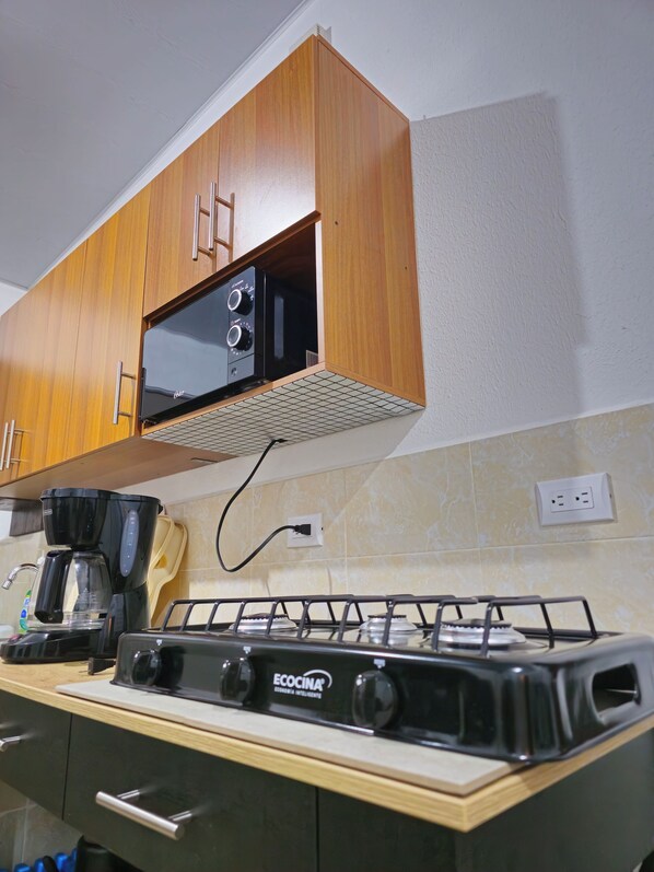 Fridge, microwave, stovetop, coffee/tea maker