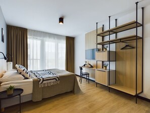 Desk, laptop workspace, bed sheets
