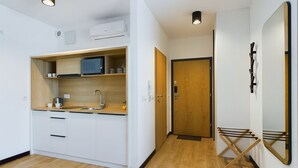 Studio, Accessible, Kitchen | Private kitchen | Coffee/tea maker, microwave, electric kettle, freezer - Rodzinne Studio&klimatyzacja by Renters (Warsaw)