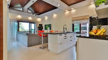 Sriprai Pool Villa | Living room | 20-inch LED TV with cable channels