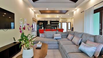 Sriprai Pool Villa | Living area | 20-inch LED TV with cable channels