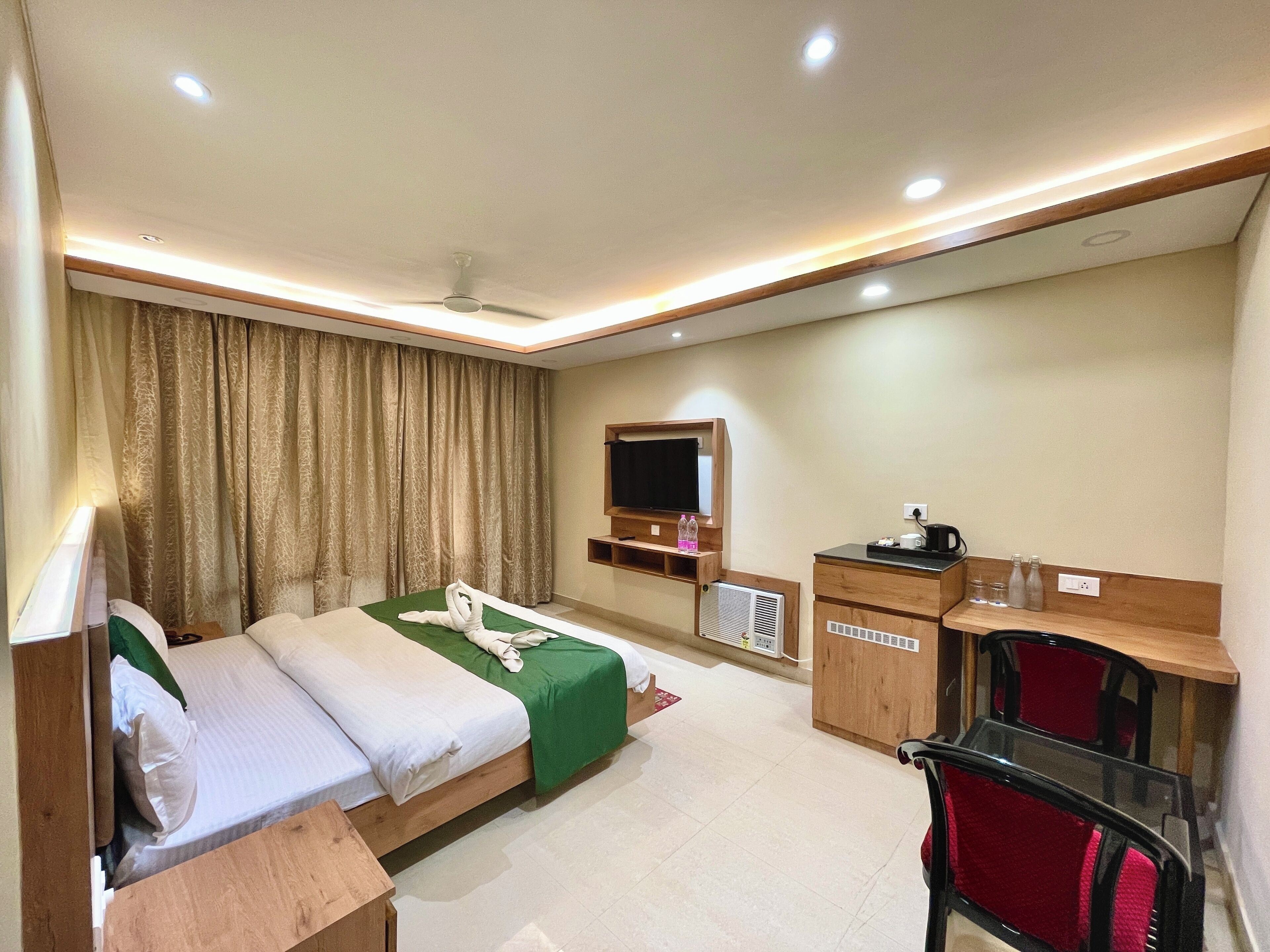 Premium bedding, desk, laptop workspace, soundproofing