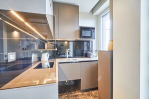 Fridge, microwave, stovetop, coffee/tea maker