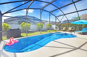 Outdoor pool, a heated pool - 4 BR POOL Home w/GAME Room & SPA. 10 Min to DISNEY Parks. BEAUTIFULLY decorated. (Kissimmee)