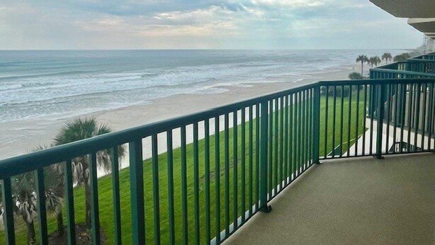 A balcony with a view of the beach and ocean. - Towers 8 & 9 8301 - Daytona Beach Oceanfront Vacations, Inc (Ponce Inlet)