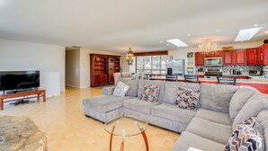 A spacious living room with a sectional sofa, a glass coffee table, and a flat-screen TV. - Scenic Home w/ Sauna - 7 Mi to Heavenly Mountain! (Stateline)