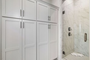 Shower, eco-friendly toiletries, hair dryer, towels