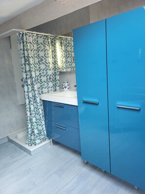 Shower, hair dryer, towels, toilet paper