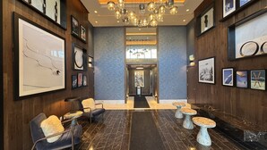 A lobby with marble flooring, framed artwork, and modern lighting fixtures. - Deer Valley East I Walk to Jordanelle Gondola I Hot Tub I Arcade (Park City)