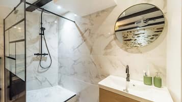 Shower, hair dryer, towels, toilet paper
