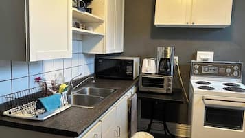 Microwave, stovetop, coffee/tea maker, electric kettle