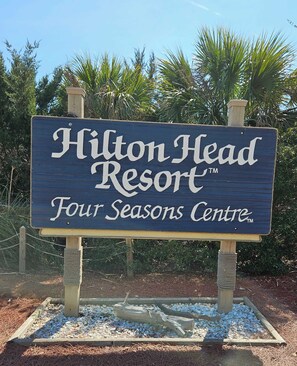 A sign for Hilton Head Resort's Four Seasons Centre. - Beachy Vibe – 2 BDR In Desirable HHI Resort! (Hilton Head Island)