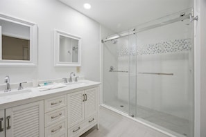Shower, hair dryer, towels, shampoo