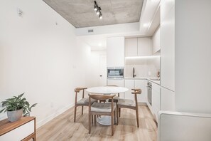 Enjoy meals in this stylish dining area with a round table and four chairs.
