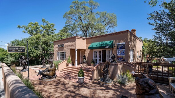 A building with a green awning and a sign reading "Sage Creek Gallery". - Casa en Canyon by Kokopelli Property Management (Santa Fe)
