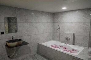 Separate tub and shower, free toiletries, towels, soap