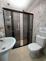 Bathtub, slippers, towels, soap