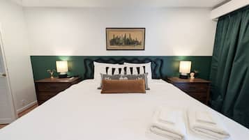 1 bedroom, desk, iron/ironing board, travel crib