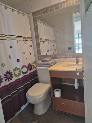 Shower, hair dryer, towels, soap