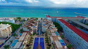 A resort with multiple swimming pools, beach access, and a view of the ocean. - Aldea Thai by AR Vacations (Playa del Carmen)
