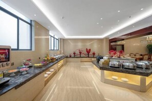 A modern hotel lobby with a long reception counter, a large window, and a decorative wall. - Huquan Bund Hotel (Mile)