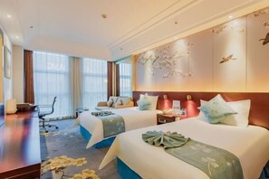 A hotel room with two beds, a desk, a chair, and a large window. - Yangfeng Yiju Hotel (Beijing)