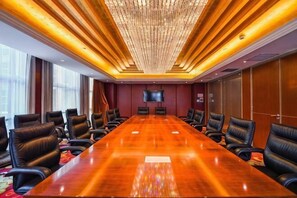 A conference room with a long table, leather chairs, a chandelier, a flat-screen TV, and a large window. - Yangfeng Yiju Hotel (Beijing)