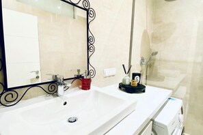 Shower, hair dryer, towels, soap