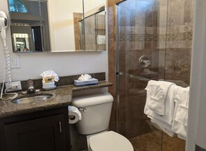 Shower, towels, soap, toilet paper