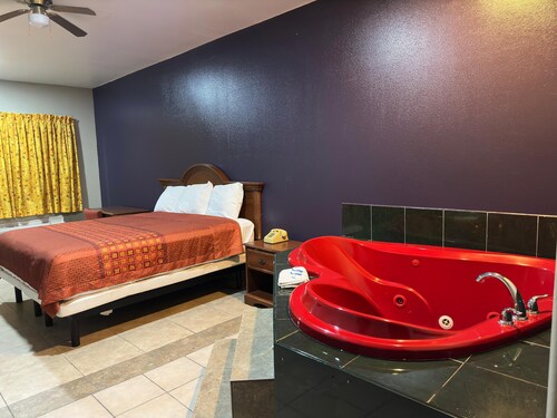 Spacious hotel suites with one king bedroom and one drawing room with Wi-Fi, AC.