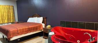 Spacious hotel suites with one king bedroom and one drawing room with Wi-Fi, AC.